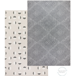 reversible dark grey play mat and neutral play mat on the reverse with an organic polka design created to complement modern interiors 