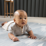 Tummy time on Baby mats by Totter and Tumble are designed with the whole family in mind the Atlas ikat design looks beautiful in the home while the memory foam protects and moulds