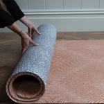 Unrolling the playmat rug by totter and tumble with a modern leopard and kilim motif for more choice in the home