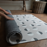 Modern one piece grey memory foam mat designed as an alternative to an area rug for practical family living