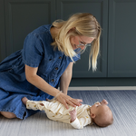 Mom and baby play on Tumbling mats by Totter and Tumble keep floor time safe made from non toxic materials the baby play mats are safe from birth 