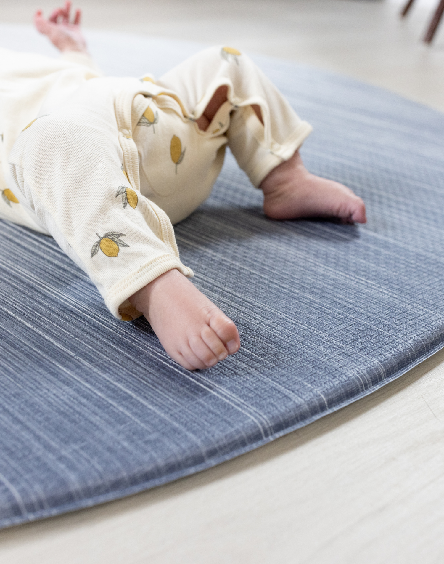 Close up of edge of playmat on Foam mats made for the whole family the navy play mat Kasuri by totter and tumble is perfect for stylish homes