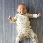 Cute baby laying on Ombre blue baby play mat made for support on the floor perfect for tummy time and playing stylish design looks great in modern interiors 