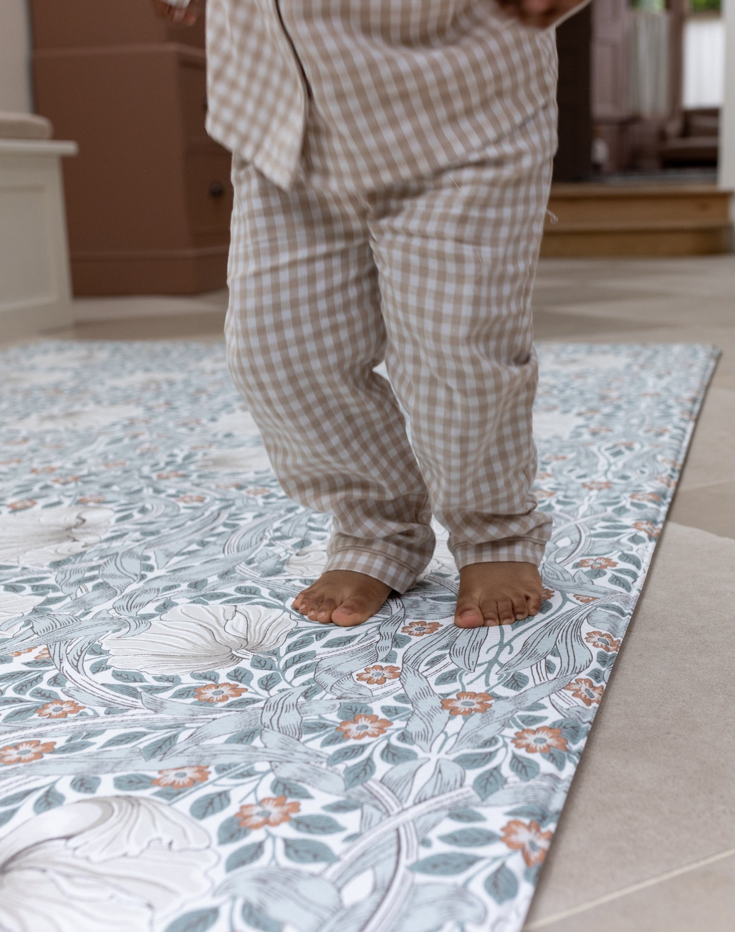 active toddler jumping on soft and cushioned play mat