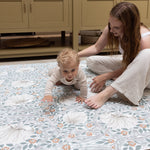 parent and child enjoying kitchen play mat