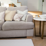 Stylish living space with a subtly designed play mat placed by the sofa for the whole family to live more comfortably