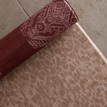 Close up of the textural Rusa play mat with the beautiful garnet red Merah on the reverse made to be safe from birth and ideal for providing ultimate protection on all types of flooring in the home 