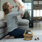 mom and baby are playing on the jumbo round kids play mat with the insta famous scout design