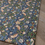 Corner of versatile play mat by Totter and Tumble sized so the whlole family can play and featuring the stylish Morris & Co. design so it sits stylishly in family homes