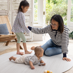 Mom and children enjoying the Baby play mats the whole family will love The Tali has a stylish ombre design with tan and beige tones