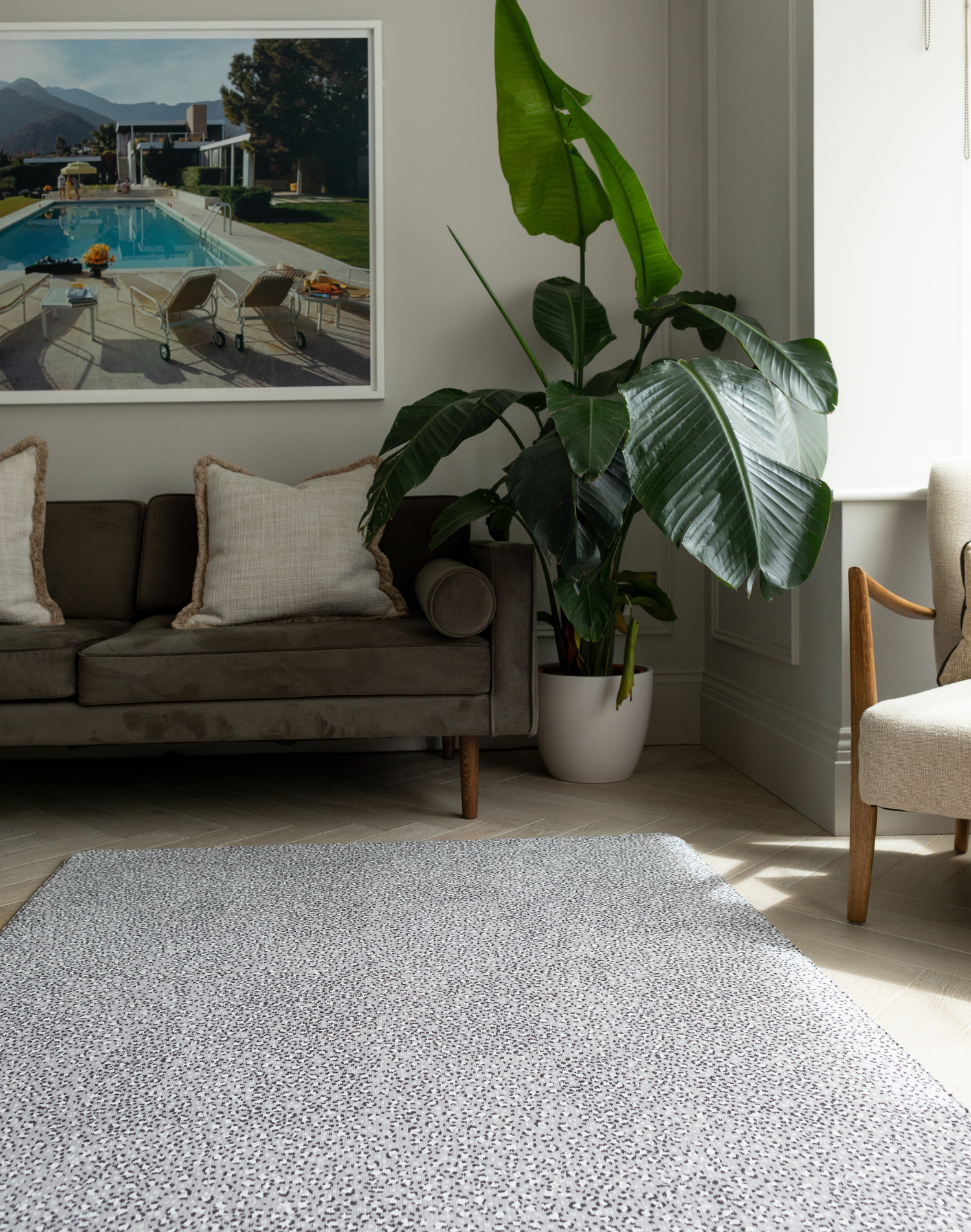 Living room with large grey play mat that works like a practical area rug