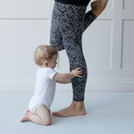 Baby and mom enjoy floor time together on the padded foam floor mat