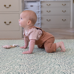 Baby in crawling stance on Morris & Co. Willow Boughs play mat by Totter and Tumble non toxic play mat perfect for babies